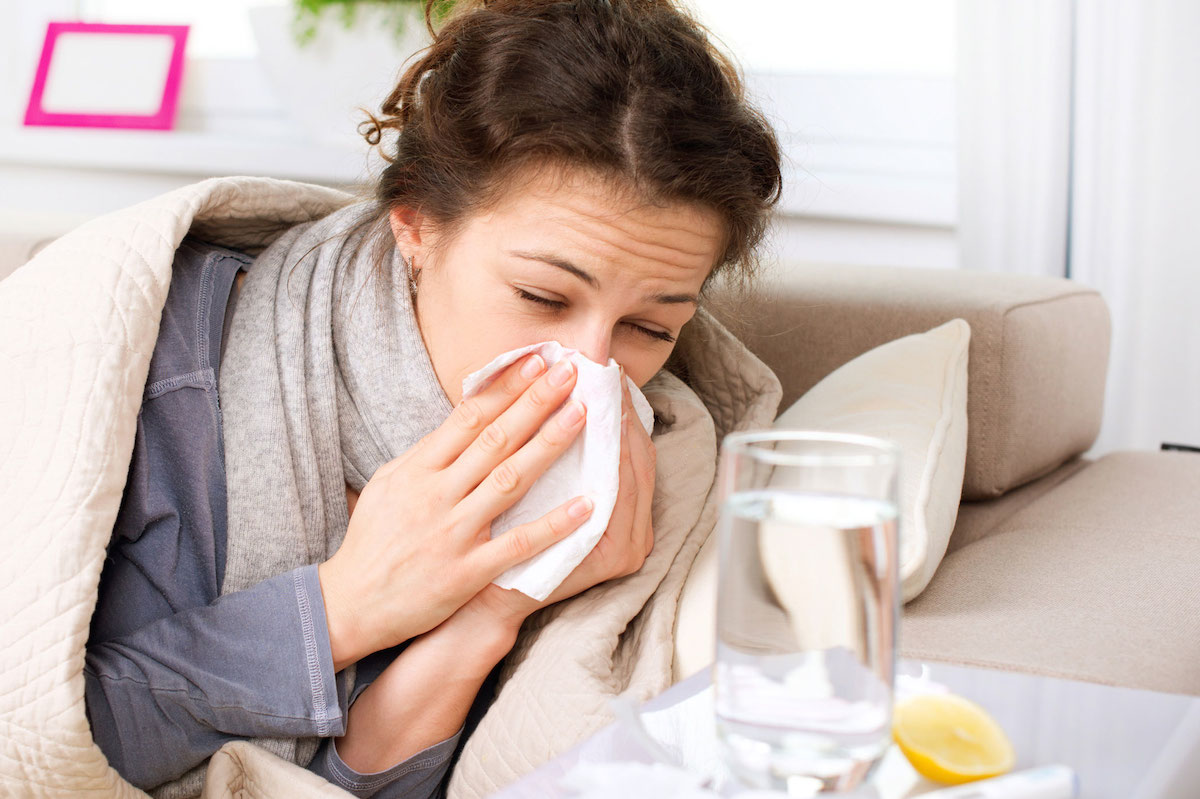 Flu or Cold. Sneezing Woman Sick Blowing Nose
